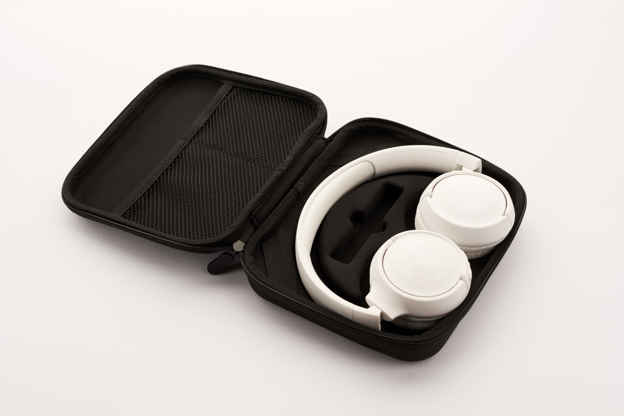 White headphones in their case