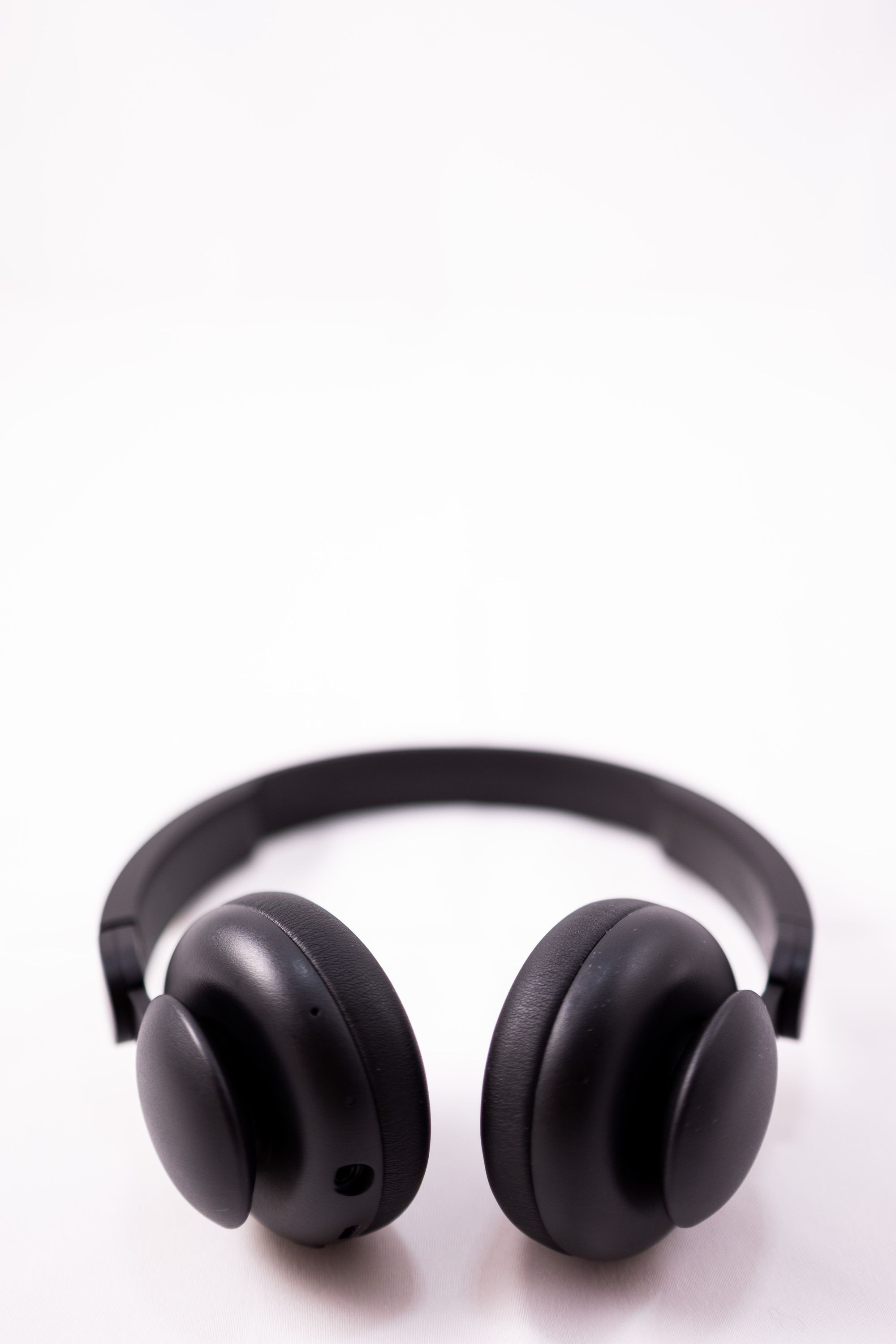 Black headphones on a white background